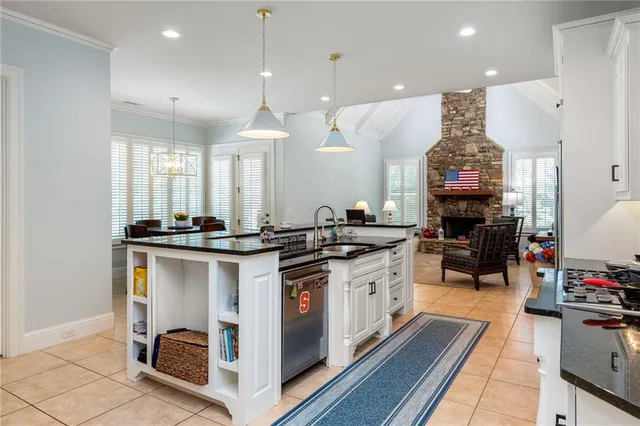 a dining room with furniture a rug and a chandelier