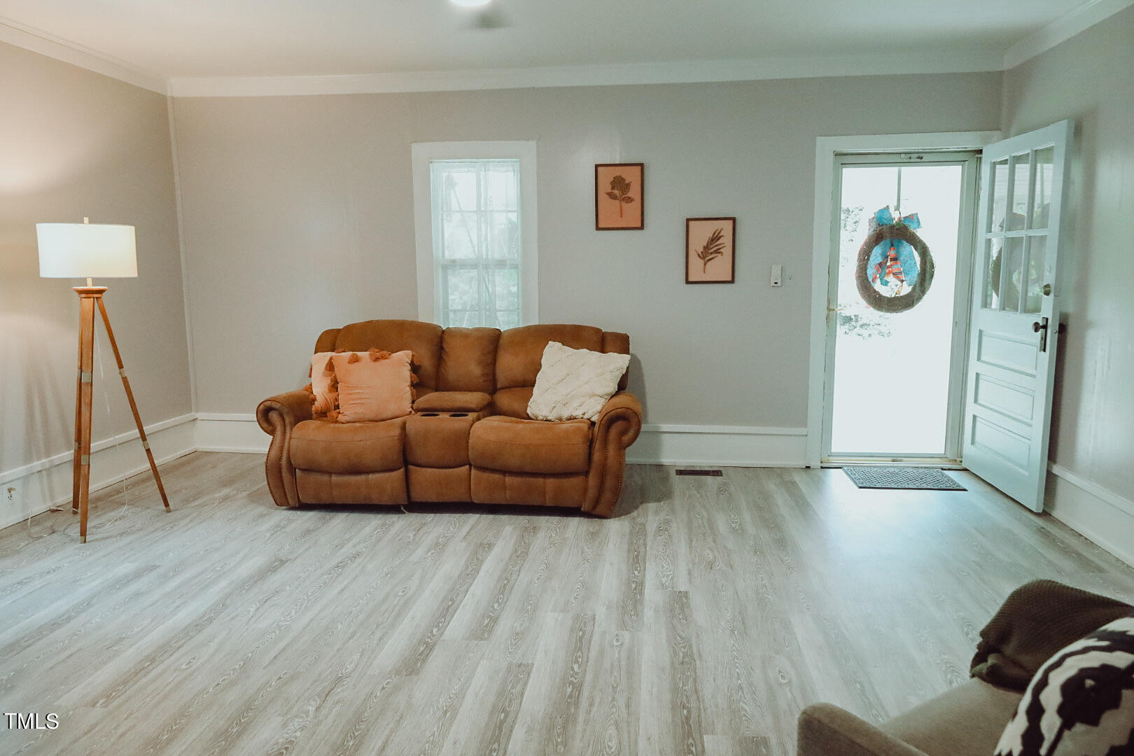 7105 Great Swamp Loop Lucama, NC 27851 - Photo 19 of 65 a living room with furniture and a wooden floor