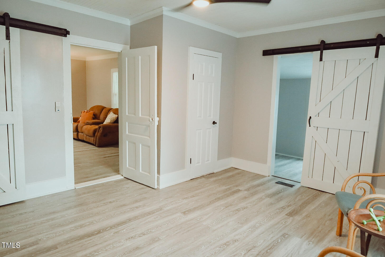 7105 Great Swamp Loop Lucama, NC 27851 - Photo 21 of 65 a view of a livingroom with wooden floor and closet