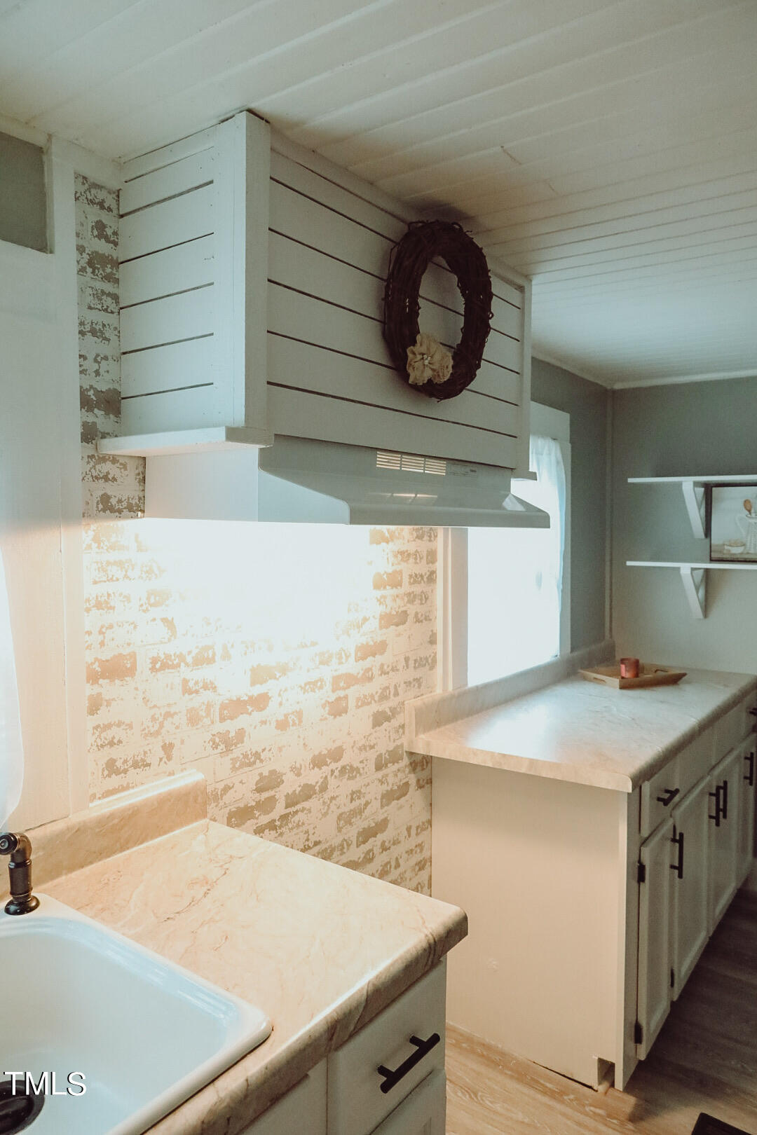 7105 Great Swamp Loop Lucama, NC 27851 - Photo 29 of 65 a kitchen with a sink and a stove