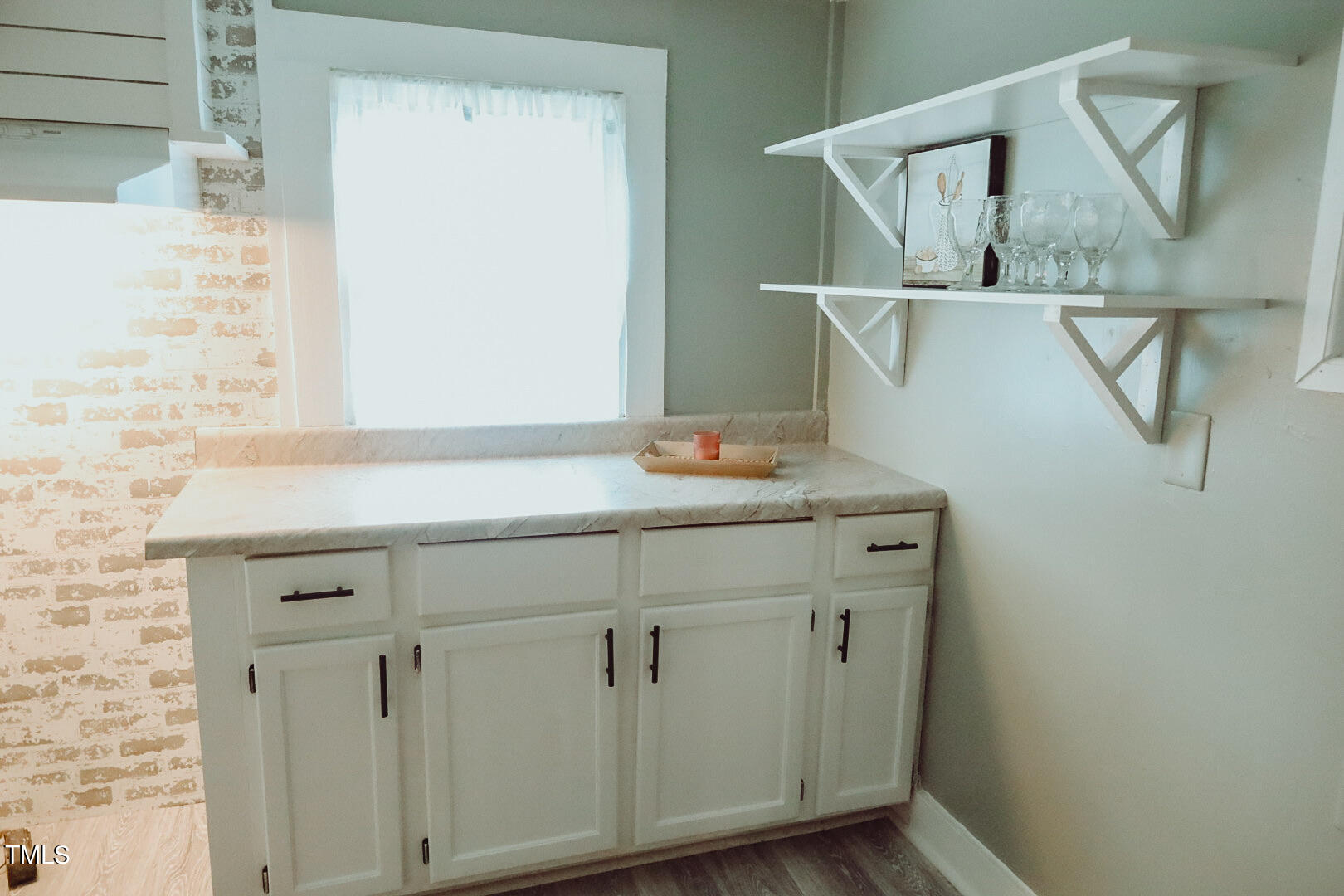 7105 Great Swamp Loop Lucama, NC 27851 - Photo 30 of 65 a bathroom with a sink and mirror