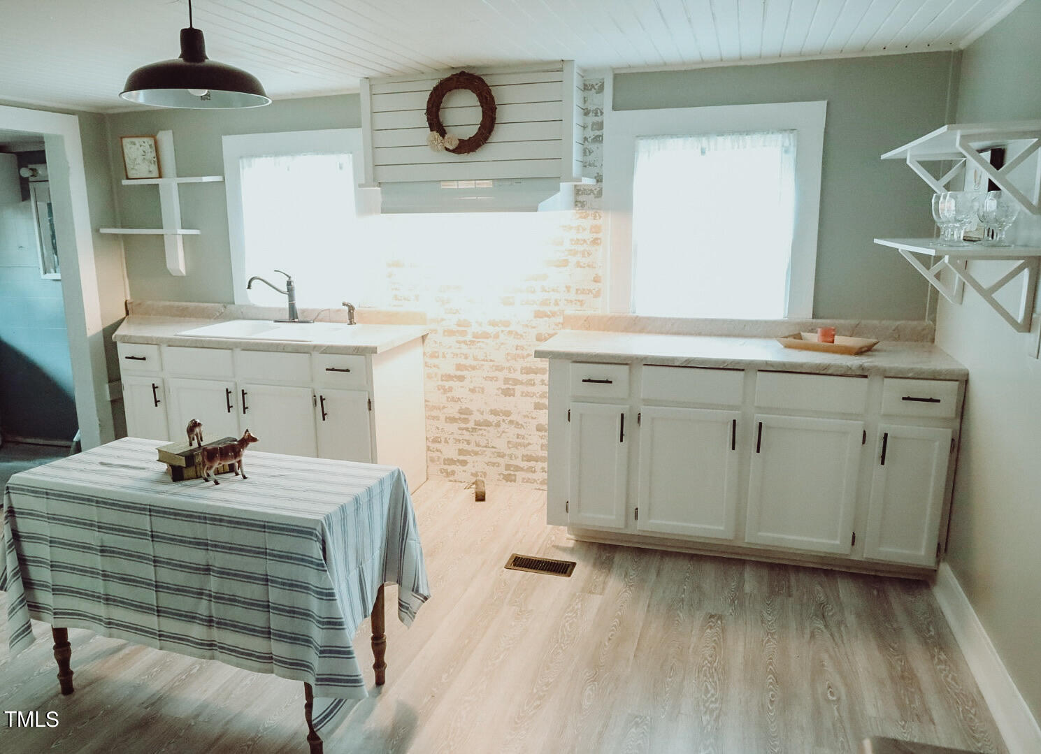 7105 Great Swamp Loop Lucama, NC 27851 - Photo 32 of 65 a bathroom with a sink and a mirror