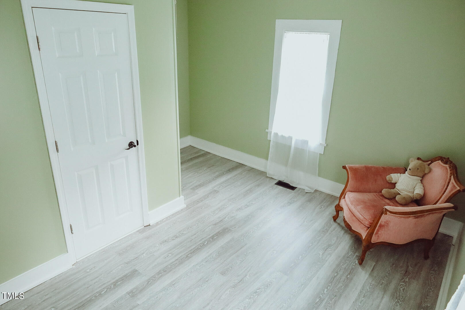 7105 Great Swamp Loop Lucama, NC 27851 - Photo 36 of 65 a room with wooden floor and couch