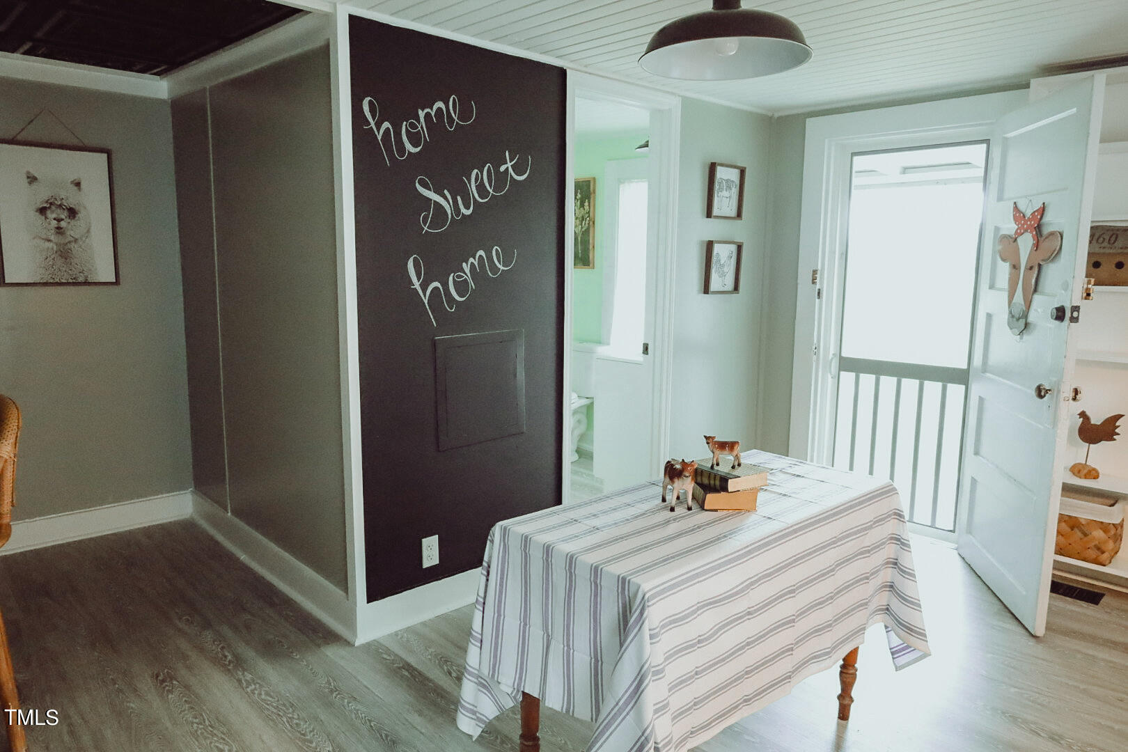 7105 Great Swamp Loop Lucama, NC 27851 - Photo 37 of 65 a bedroom with a bed and wooden floor