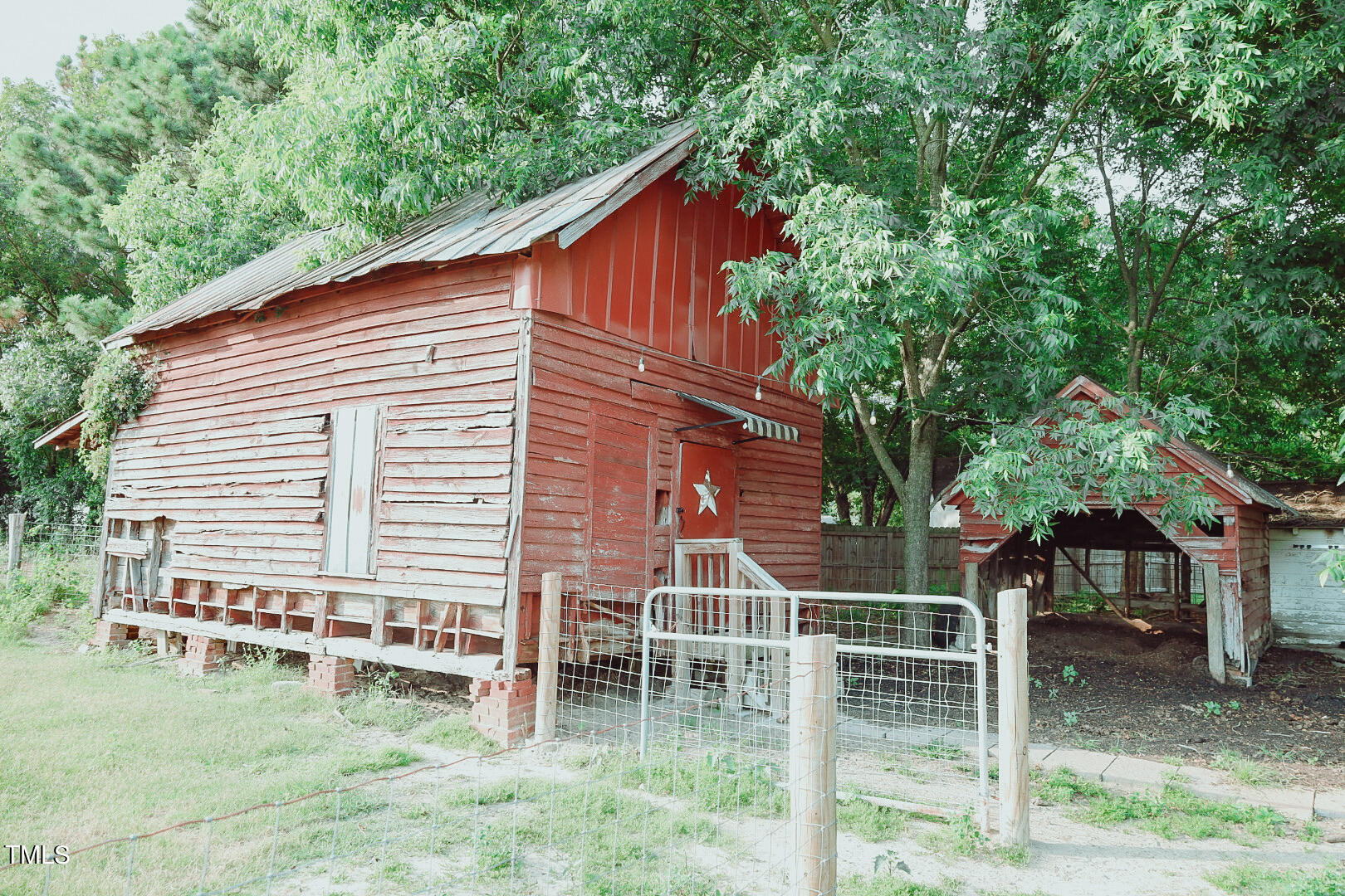 7105 Great Swamp Loop Lucama, NC 27851 - Photo 48 of 65 a backyard of a house with table and chairs