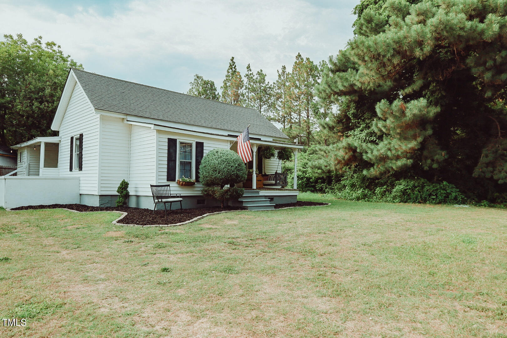 7105 Great Swamp Loop Lucama, NC 27851 - Photo 61 of 65 a view of a house with backyard and sitting area