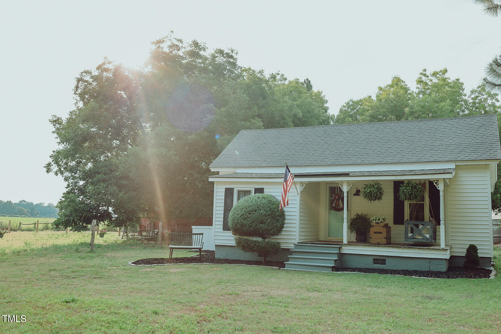 7105 Great Swamp Loop Lucama, NC 27851 - Photo 64 of 65 a front view of a house with a garden