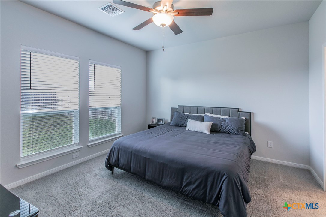 908 Coriander Road Temple, TX 76501 - Photo 12 of 28 a bedroom with a bed and window