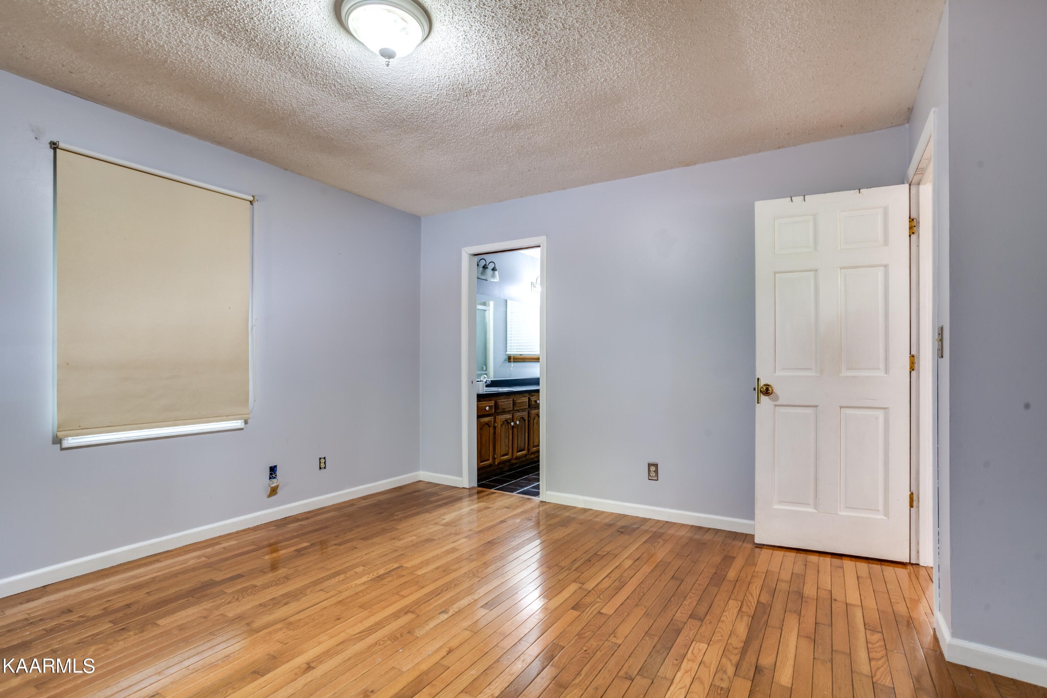 126 Taylor Road Oak Ridge, TN 37830 - Photo 20 of 34 an empty room with wooden floor and windows