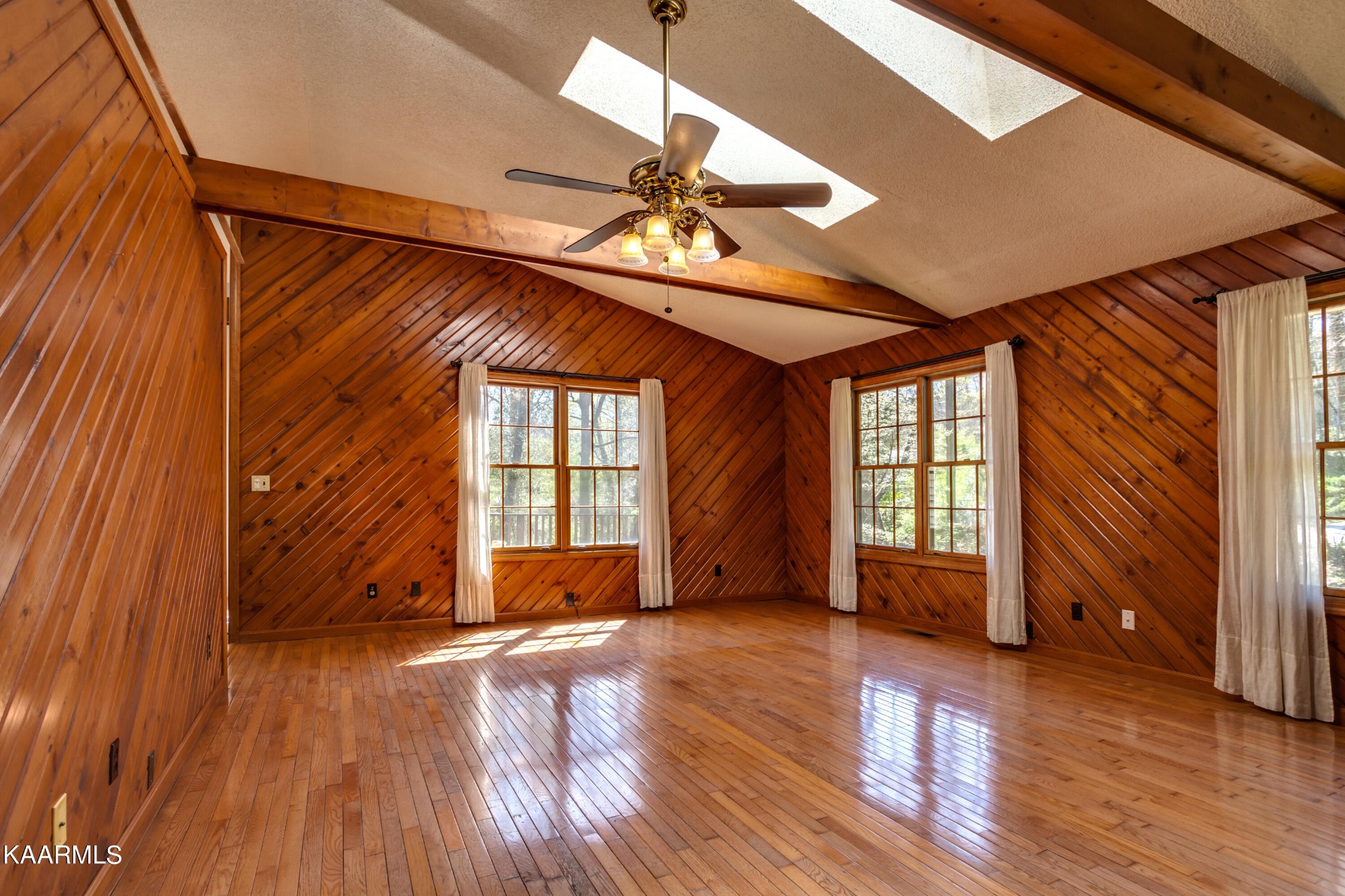 126 Taylor Road Oak Ridge, TN 37830 - Photo 3 of 34 a view of an empty room with wooden floor and a window
