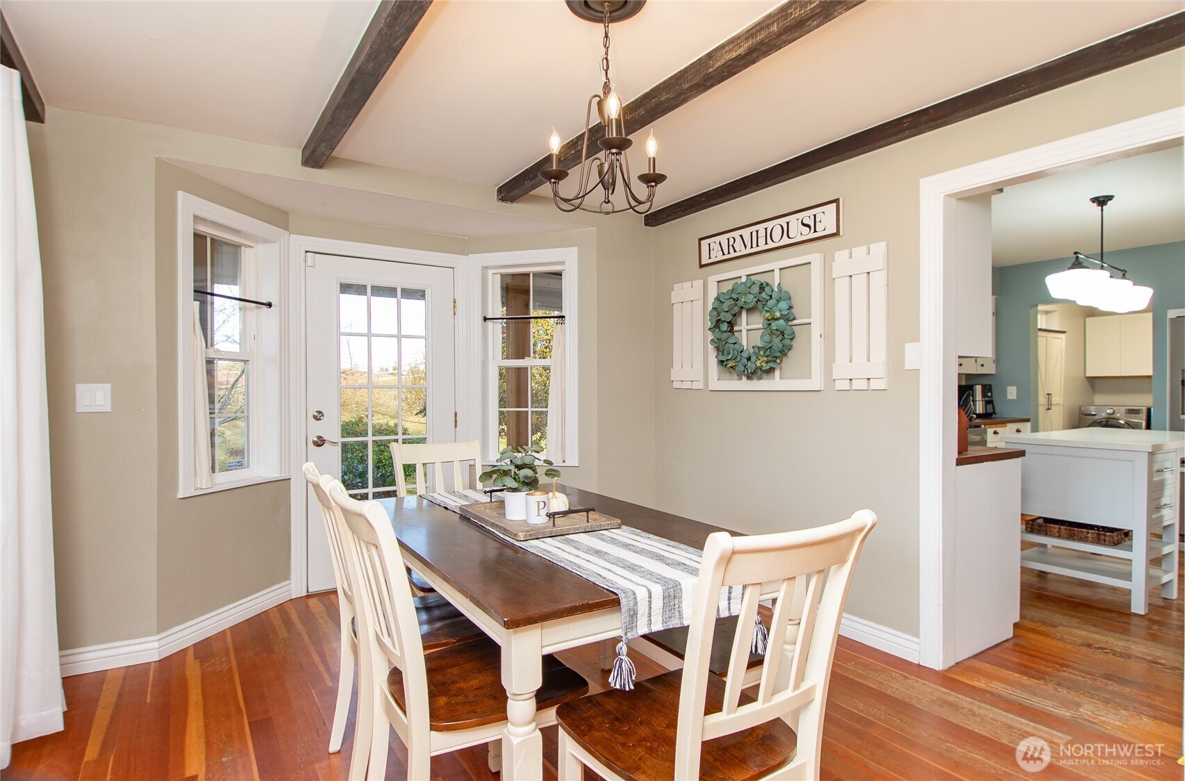 6084 Olson Road Ferndale, WA 98248 - Photo 11 of 40 a view of a dining room with furniture window and wooden floor