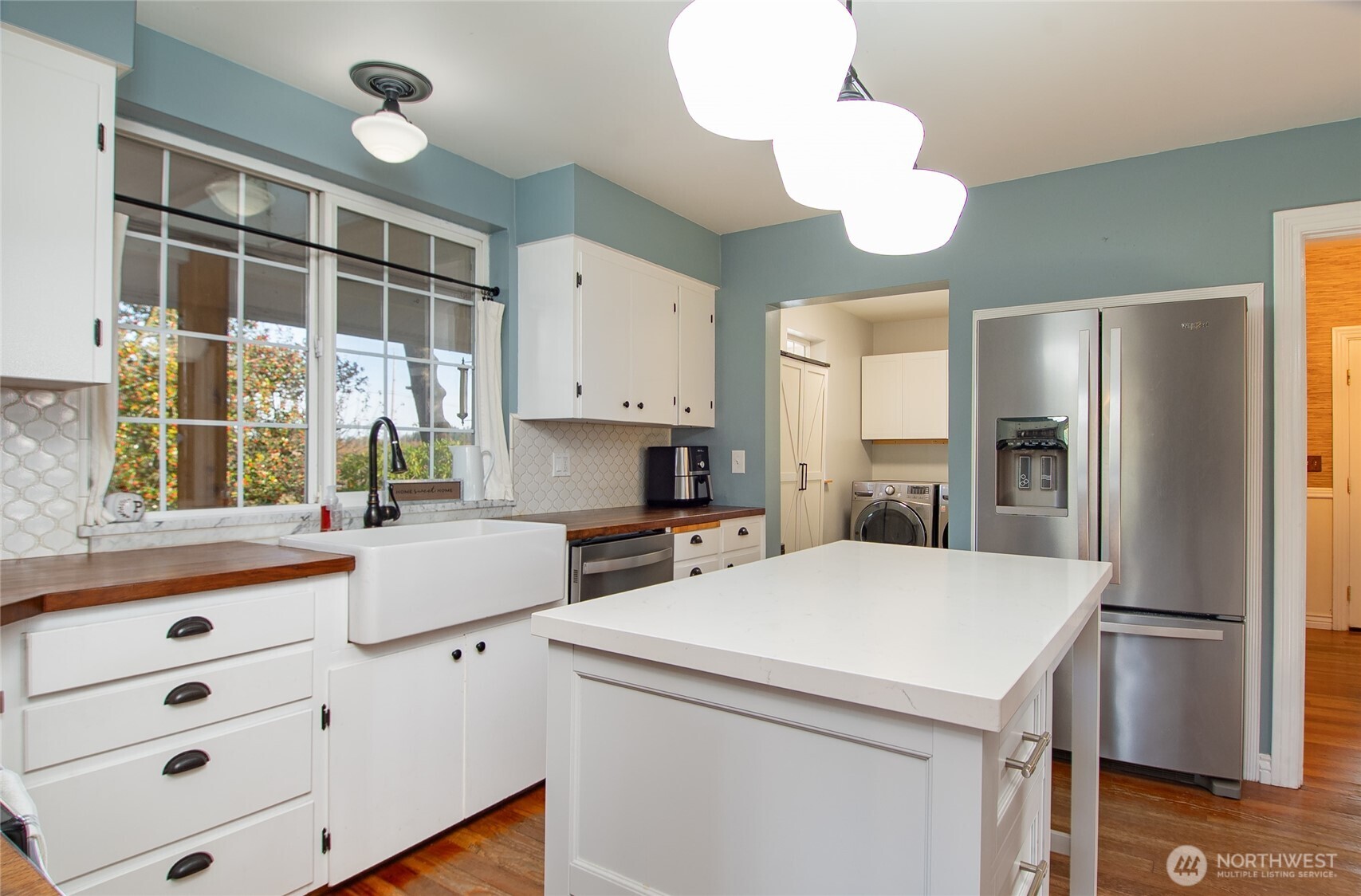 6084 Olson Road Ferndale, WA 98248 - Photo 14 of 40 a kitchen with stainless steel appliances a refrigerator sink and cabinets