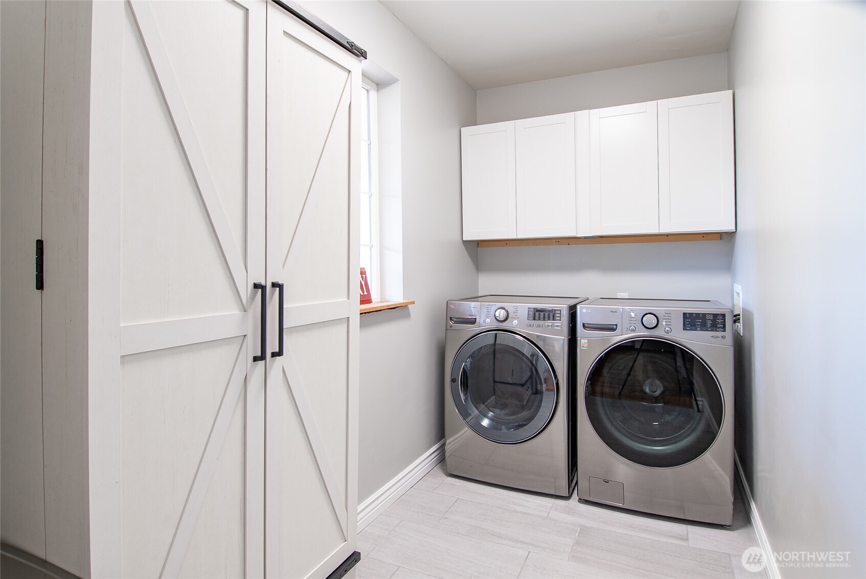 6084 Olson Road Ferndale, WA 98248 - Photo 15 of 40 a utility room with wooden floor washer and dryer