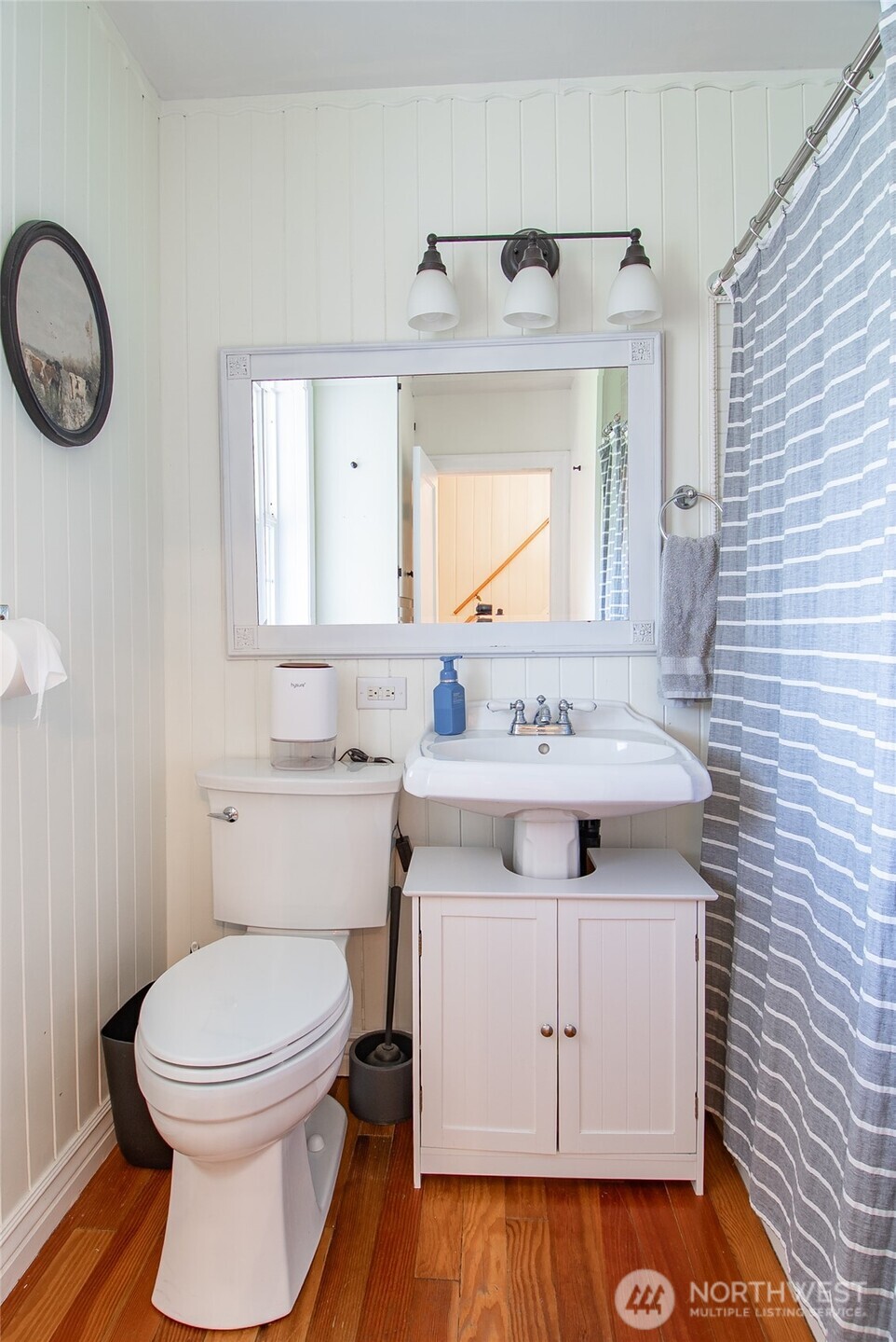 6084 Olson Road Ferndale, WA 98248 - Photo 16 of 40 a bathroom with a sink a toilet and a mirror