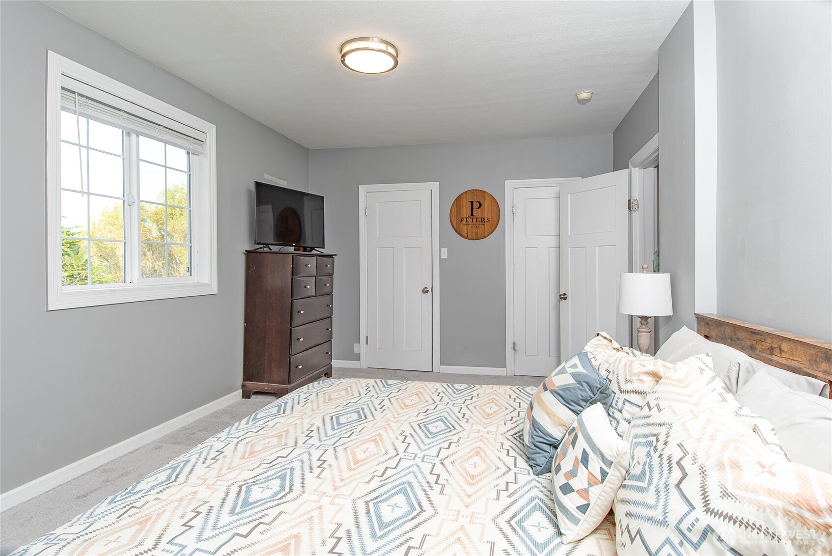 6084 Olson Road Ferndale, WA 98248 - Photo 19 of 40 a bedroom with a bed and a window