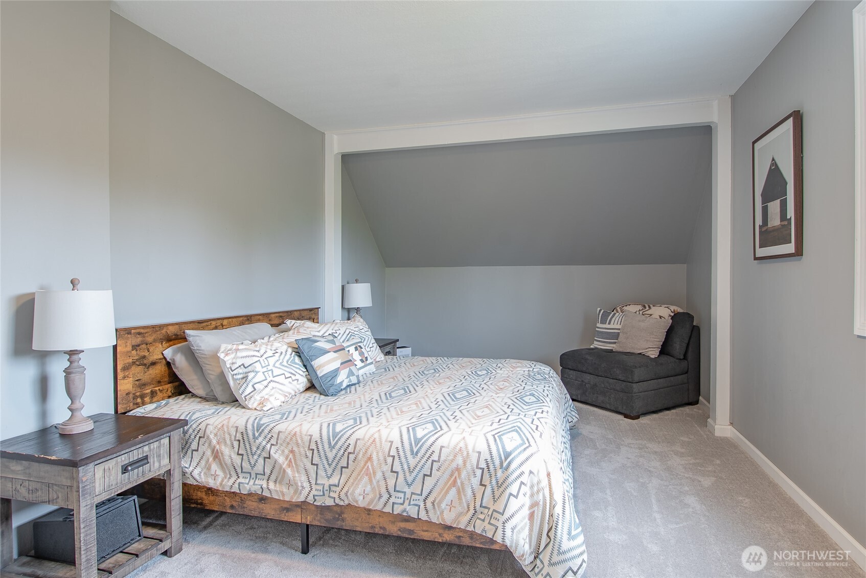 6084 Olson Road Ferndale, WA 98248 - Photo 20 of 40 a bedroom with a bed and a couch