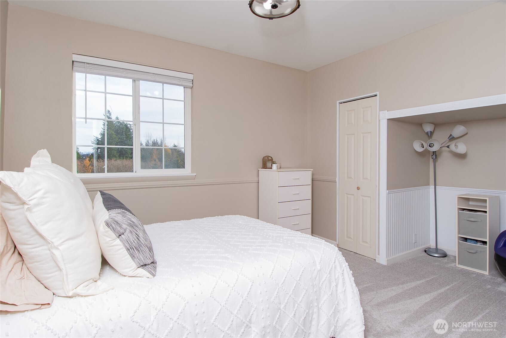 6084 Olson Road Ferndale, WA 98248 - Photo 22 of 40 a bedroom with a bed and a window