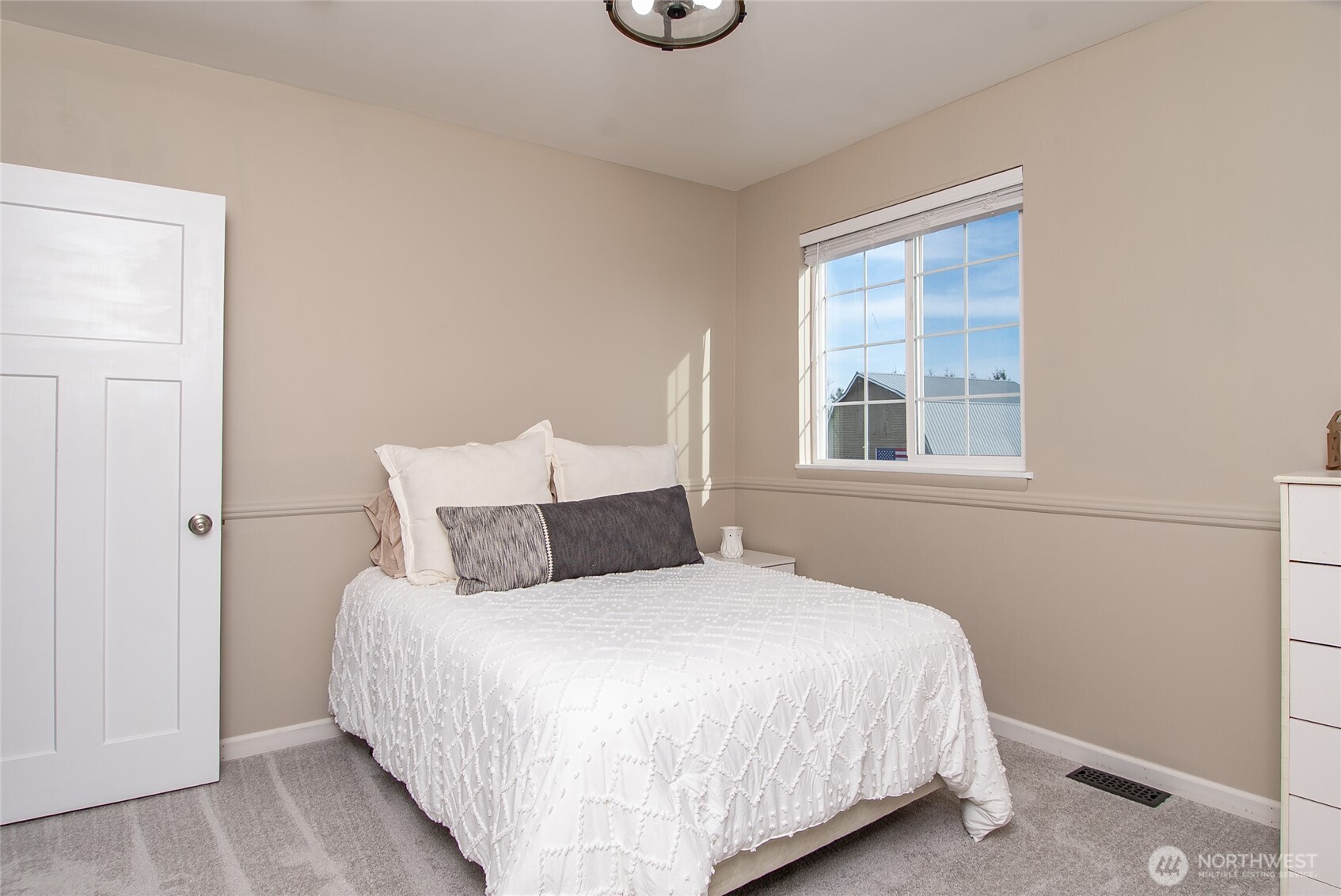 6084 Olson Road Ferndale, WA 98248 - Photo 23 of 40 a bedroom with a bed and window