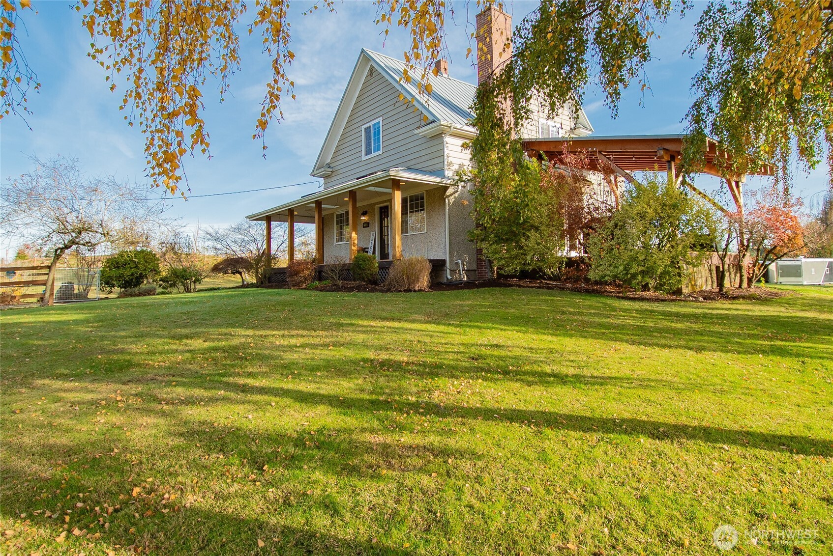 6084 Olson Road Ferndale, WA 98248 - Photo 39 of 40 a view of a house next to a yard with big trees