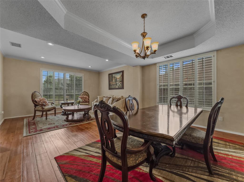 2317 Wellesly Road Rowlett, TX 75089 - Photo 15 of 39 a view of a dining room with furniture window and wooden floor