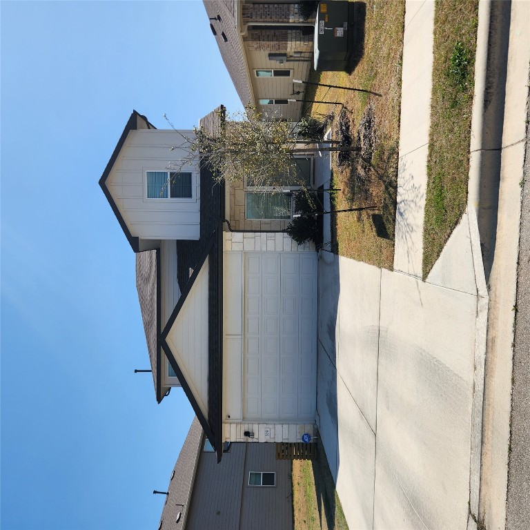a front view of a house with garage