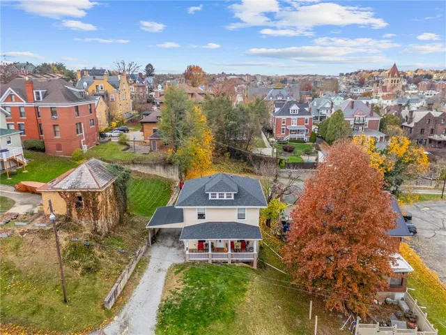 an aerial view of a house with a garden