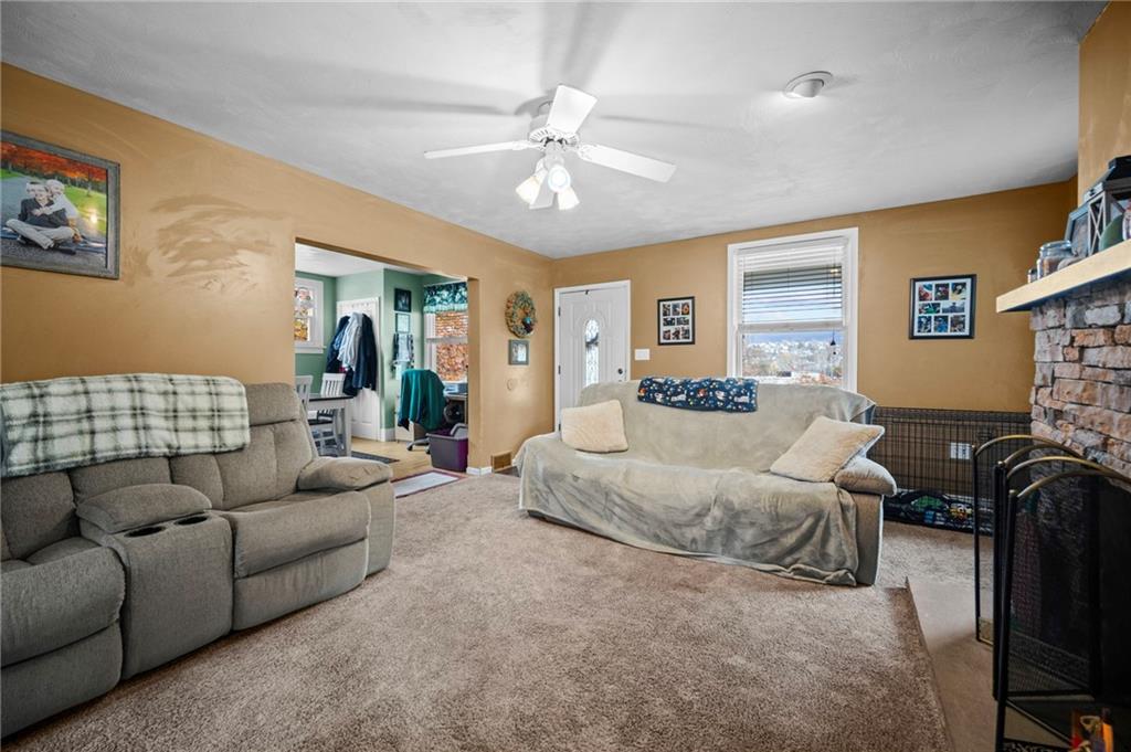 10 Jacquette Place Uniontown, PA 15401 - Photo 4 of 35 a living room with furniture and a flat screen tv