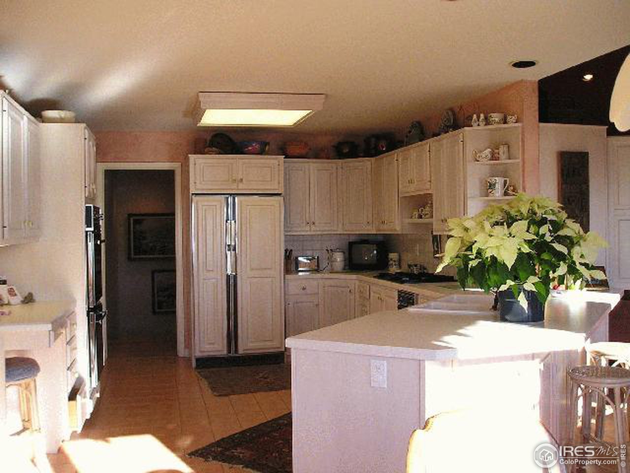 1929 Linden Ridge Drive Fort Collins, CO 80524 - Photo 3 of 6 a kitchen with refrigerator and cabinets