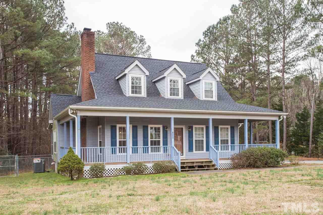 7505 Penny Road Raleigh, NC 27606 - Photo 2 of 25 front view of a house with a yard