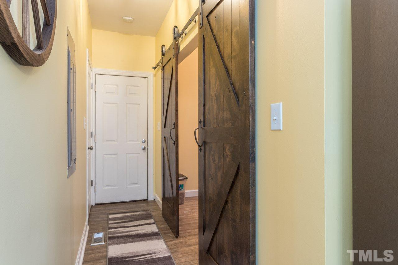 7505 Penny Road Raleigh, NC 27606 - Photo 16 of 25 a bathroom with a shower