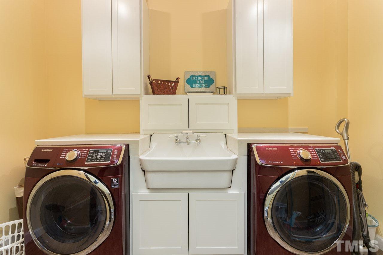 7505 Penny Road Raleigh, NC 27606 - Photo 17 of 25 a utility room with dryer and washer