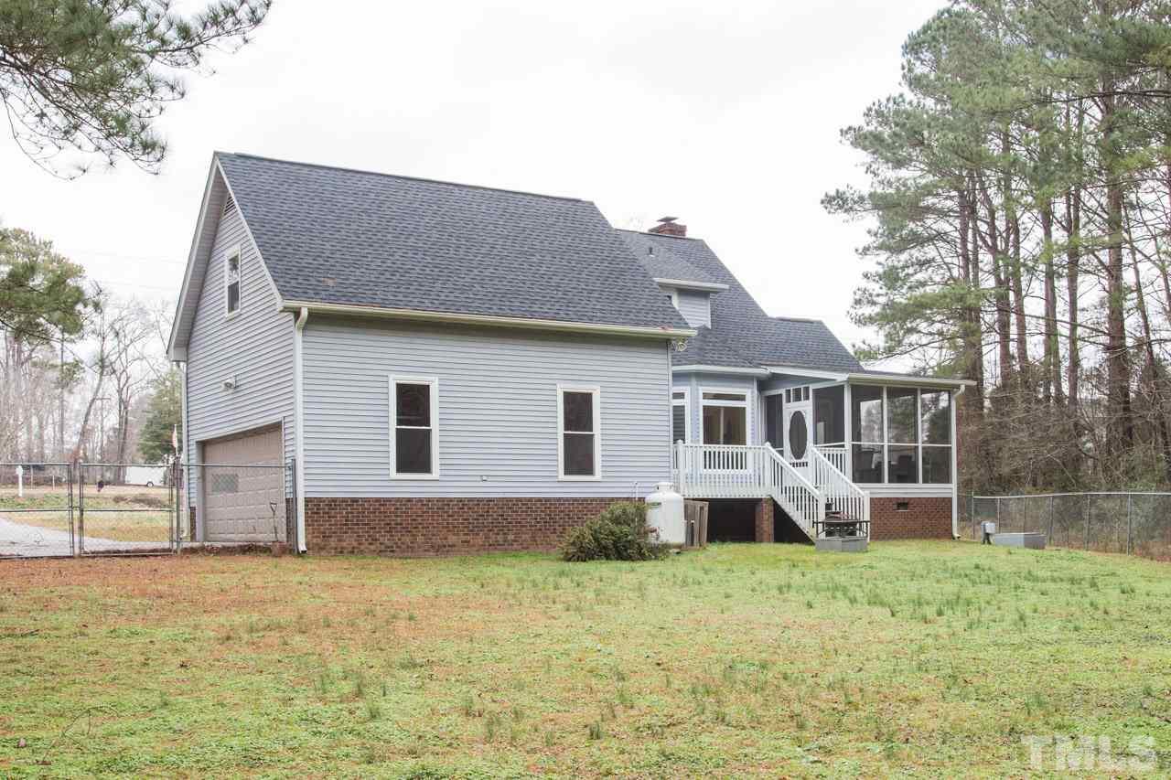 7505 Penny Road Raleigh, NC 27606 - Photo 3 of 25 a front view of a house with a yard