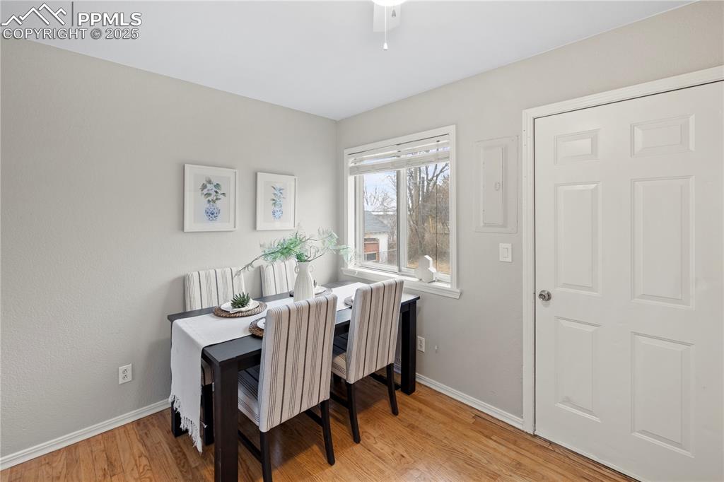 4127 Bent Drive Colorado Springs, CO 80909 - Photo 11 of 41 a view of a dining room with furniture window and wooden floor