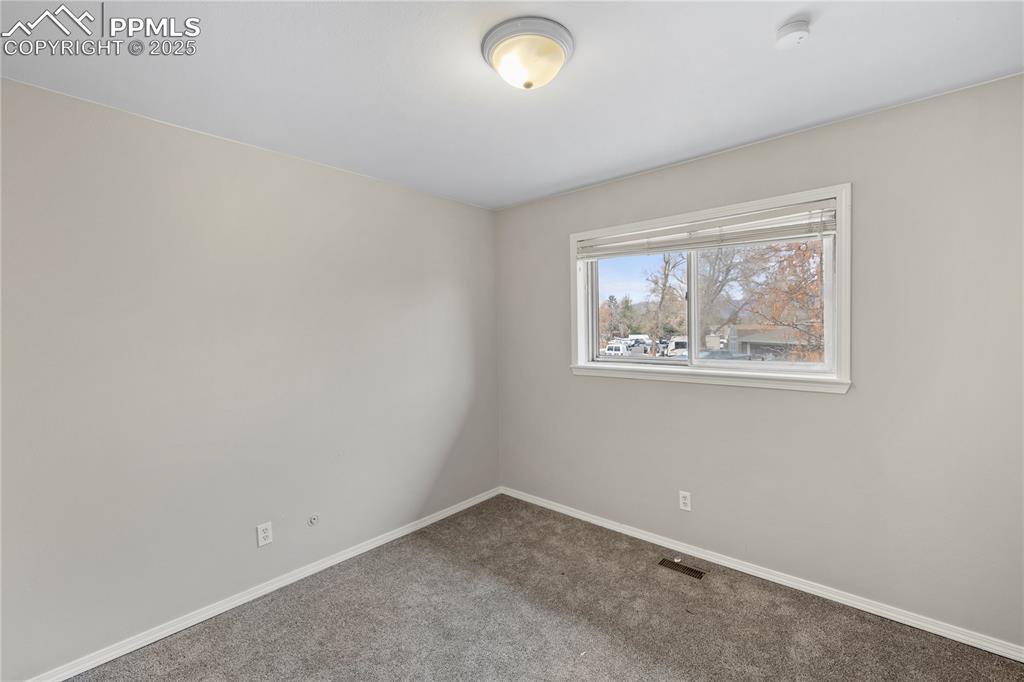 4127 Bent Drive Colorado Springs, CO 80909 - Photo 17 of 41 an empty room with windows