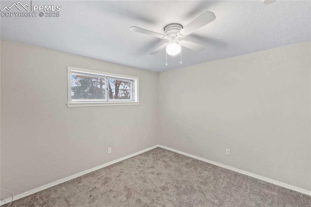 4127 Bent Drive Colorado Springs, CO 80909 - Photo 24 of 41 an empty room with a window