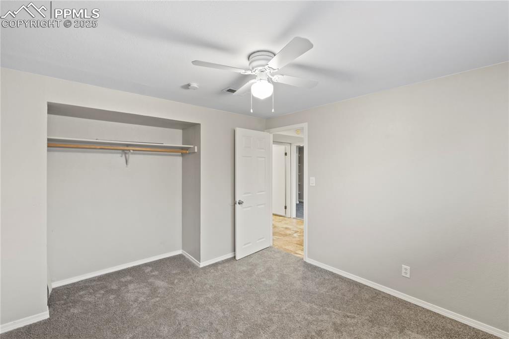 4127 Bent Drive Colorado Springs, CO 80909 - Photo 25 of 41 an empty room with closet and a ceiling fan