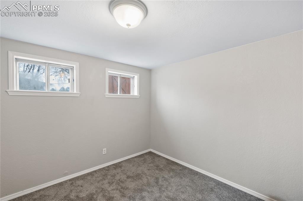 4127 Bent Drive Colorado Springs, CO 80909 - Photo 26 of 41 an empty room with windows