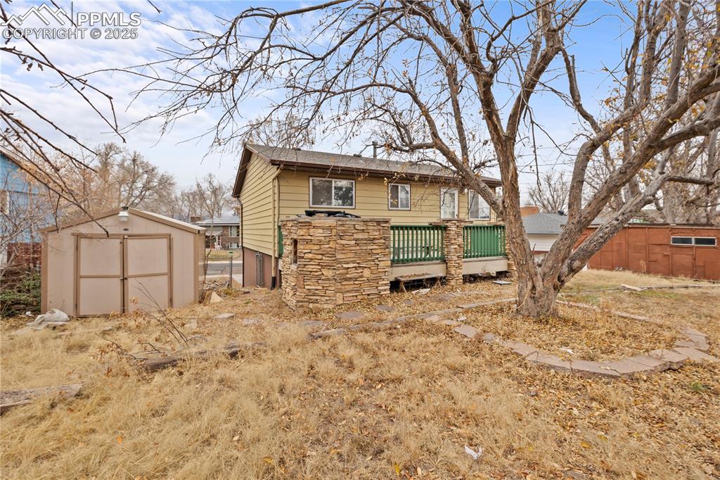 4127 Bent Drive Colorado Springs, CO 80909 - Photo 30 of 41 a view of a house with a snow in the yard