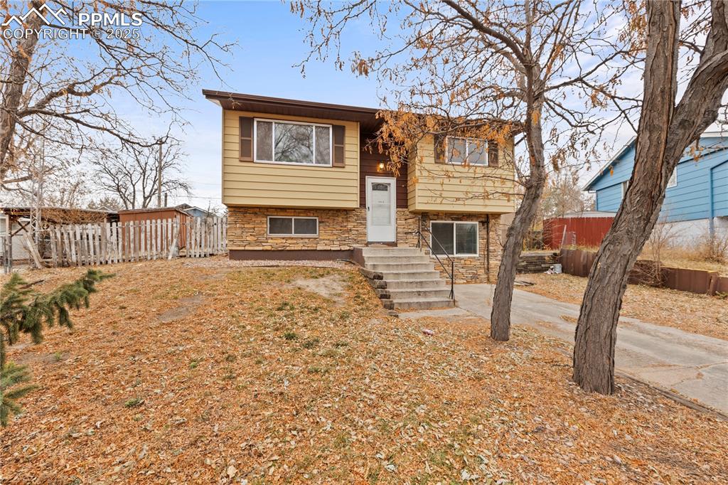 4127 Bent Drive Colorado Springs, CO 80909 - Photo 3 of 41 a view of a house with a snow on the road