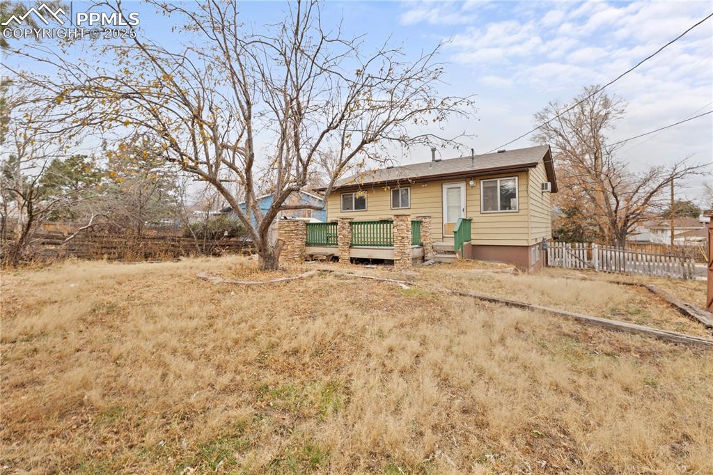 4127 Bent Drive Colorado Springs, CO 80909 - Photo 31 of 41 a view of a house with a yard covered in snow