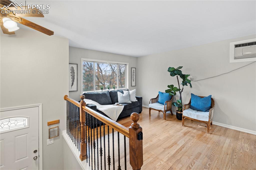 4127 Bent Drive Colorado Springs, CO 80909 - Photo 5 of 41 a living room with furniture and wooden floor