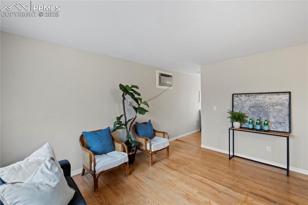 4127 Bent Drive Colorado Springs, CO 80909 - Photo 7 of 41 a living room with furniture and a wooden floor