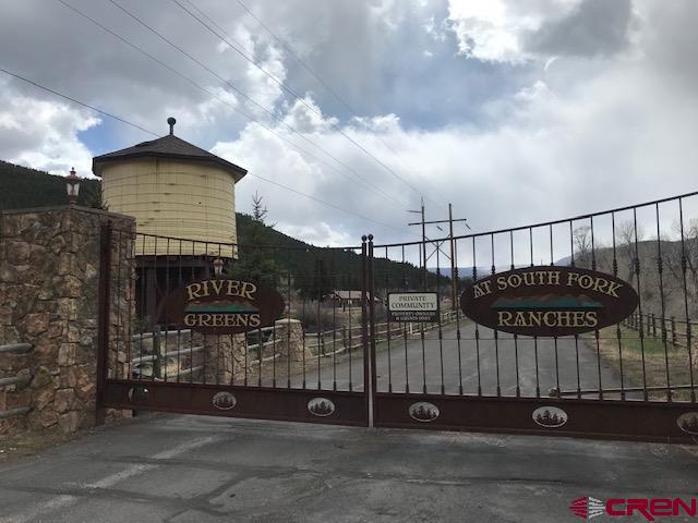 132 West Riverside Court South Fork, CO 81154 - Photo 3 of 6 a view of a house with a iron gate