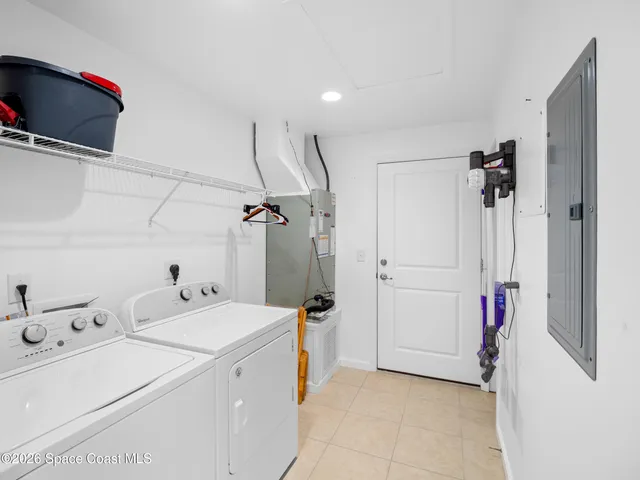 a view of storage and utility room with a washer and dryer