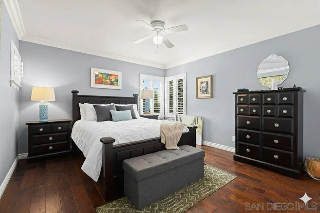 2038 South Freeman Street Oceanside, CA 92054 - Photo 14 of 23 a bedroom with a bed and a chandelier