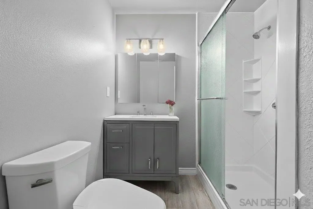 2038 South Freeman Street Oceanside, CA 92054 - Photo 18 of 23 a bathroom with a sink a toilet and shower