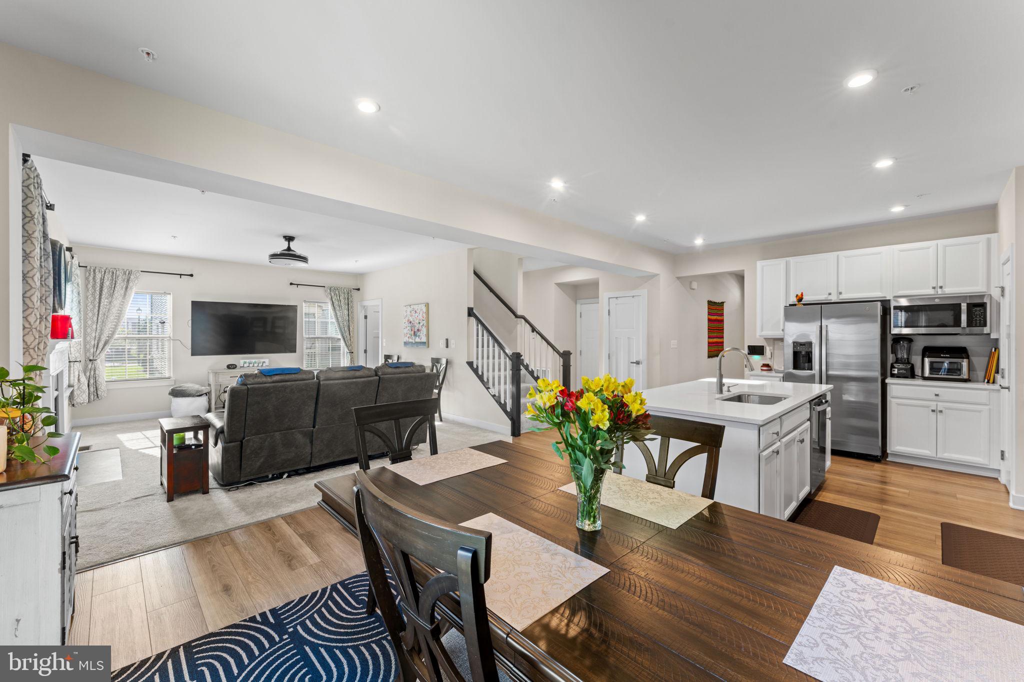 8003 Trimbles Ford Lane Brandywine, MD 20613 - Photo 16 of 70 a living room with furniture kitchen view and a flat screen tv