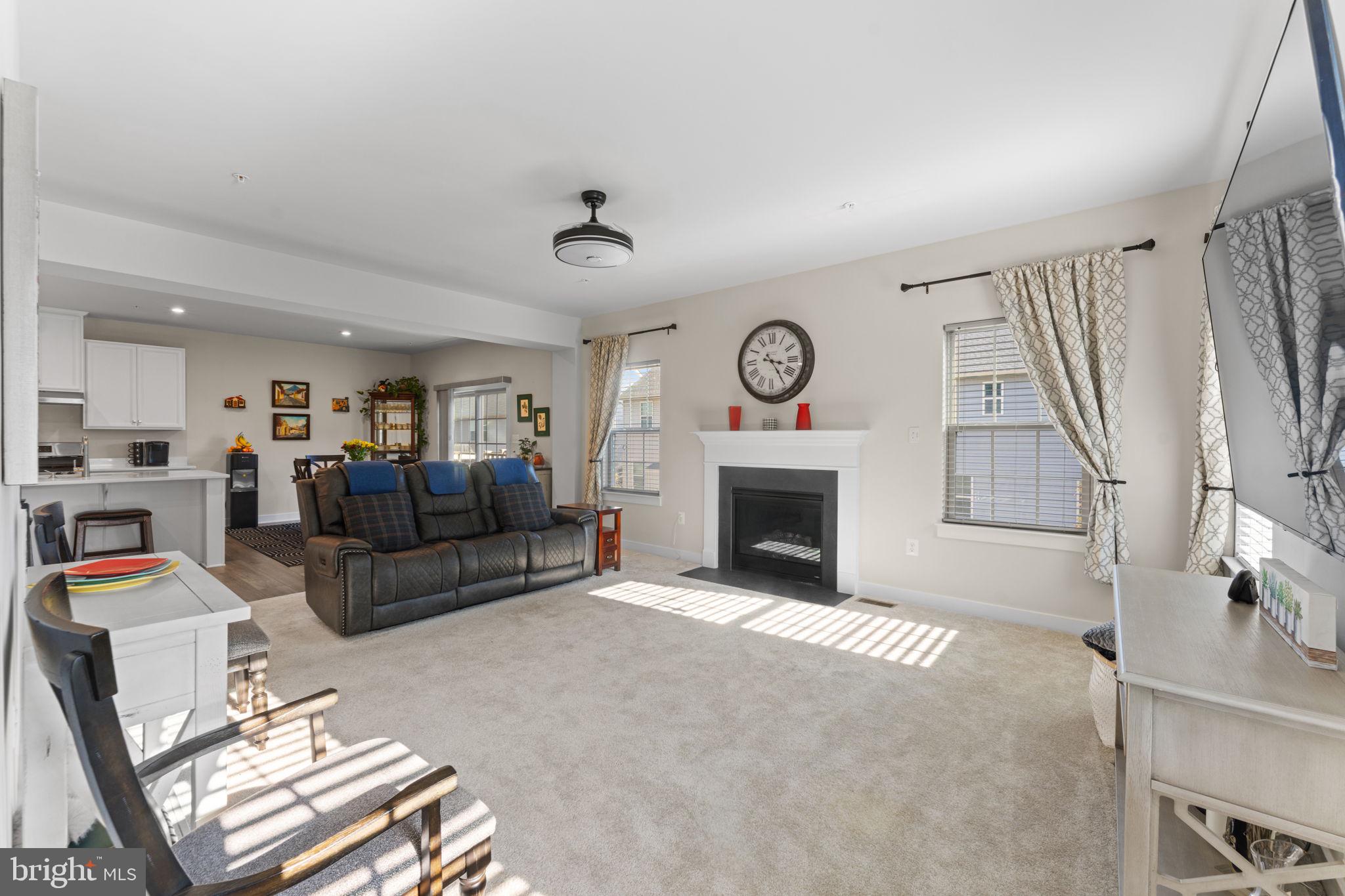 8003 Trimbles Ford Lane Brandywine, MD 20613 - Photo 20 of 70 a living room with furniture a clock and a fireplace