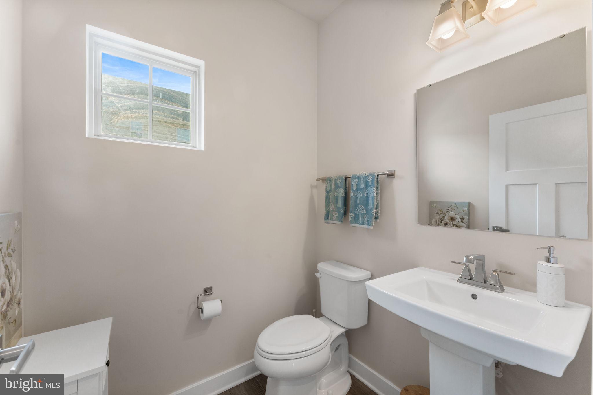 8003 Trimbles Ford Lane Brandywine, MD 20613 - Photo 21 of 70 a bathroom with a toilet a sink and mirror