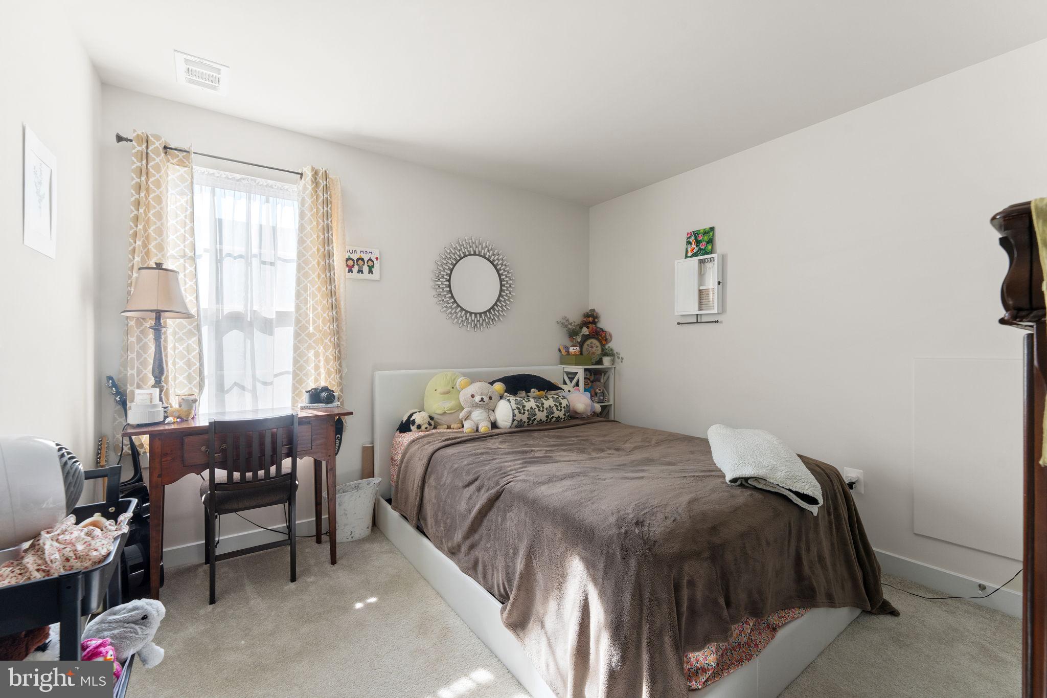 8003 Trimbles Ford Lane Brandywine, MD 20613 - Photo 25 of 70 a bedroom with a bed and a window